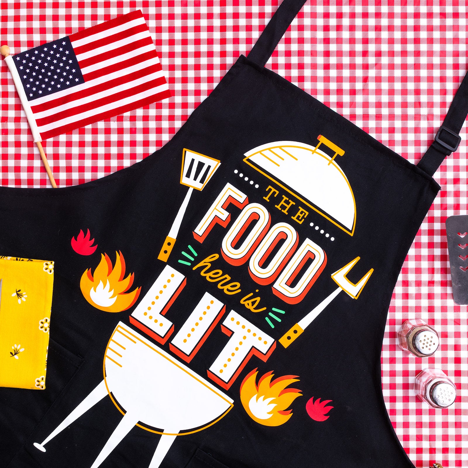 The Food Here Is Lit Apron