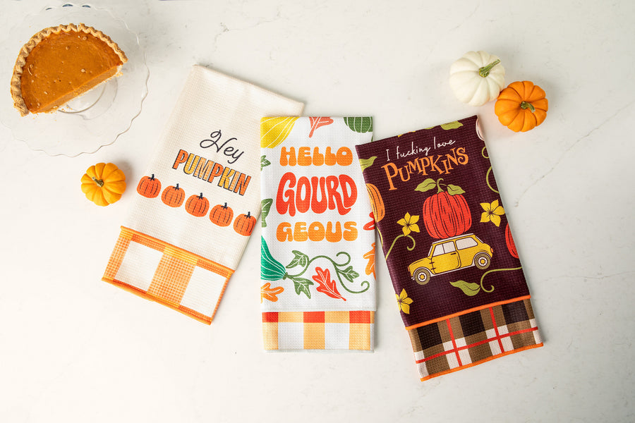 Three Lavley pumpkin towels showing playful designs and coordinating reverse patterns.