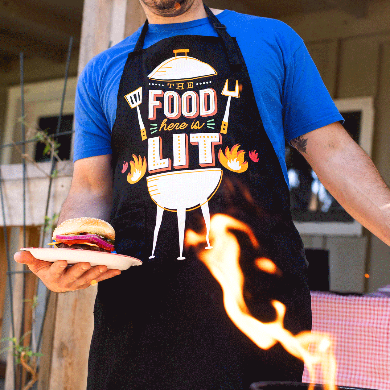 The Food Here Is Lit Apron